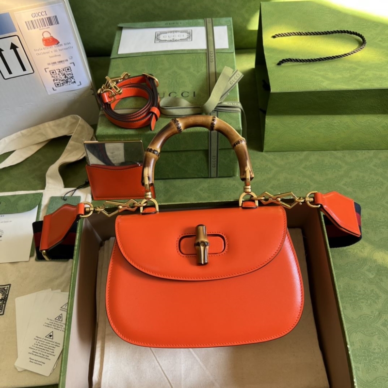 G*u*i top handle bags